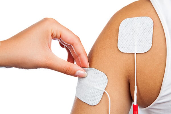 electrodes of tens device on shoulder tens therapy nerve stimulation