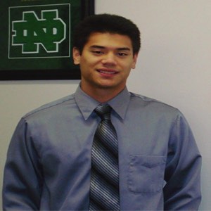 2013 scholarship winner Matthew McCreary in a grey shirt with tie