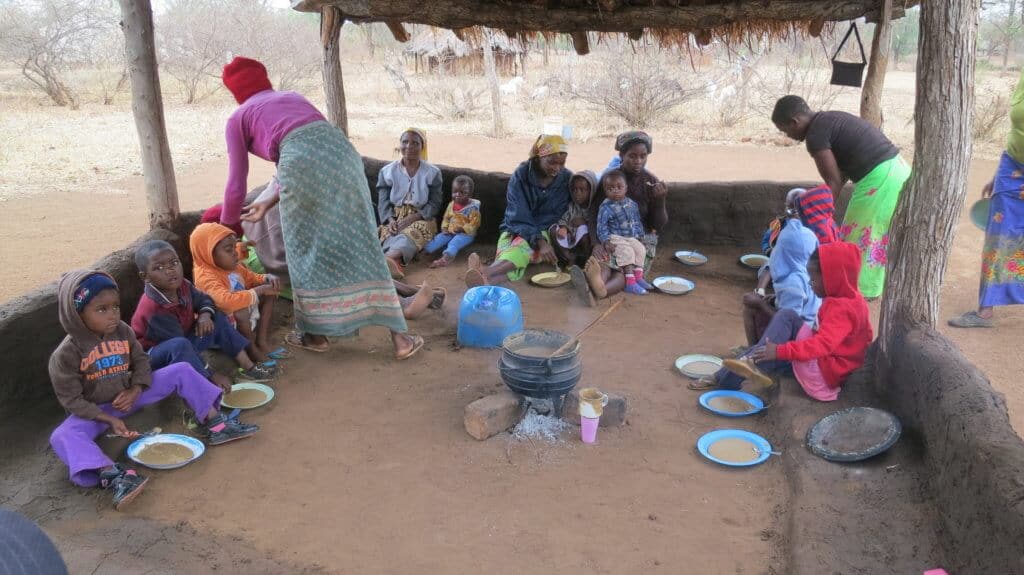 feeding station in Zimbabwe, children eating