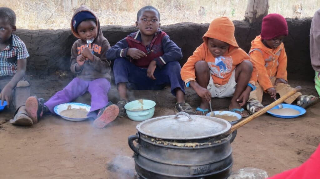 feeding station in Zimbabwe, children eating