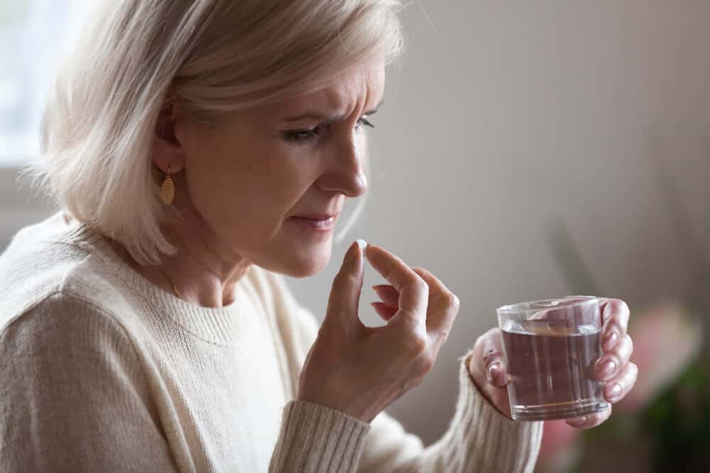 https://www.shutterstock.com/image-photo/upset-senior-ill-woman-holding-pill-1185179185